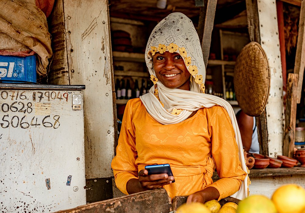 Local market lady selling fruits to experience culture in Tanzania 